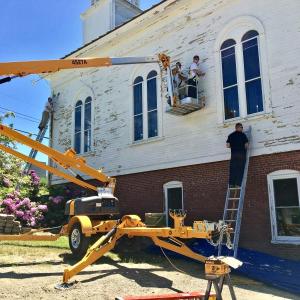 Trustees, or inmates, from Two Bridges Regional Jail work on Edgecomb Community Church on Cross Point Road on June 14. SUZI THAYER/Boothbay Register