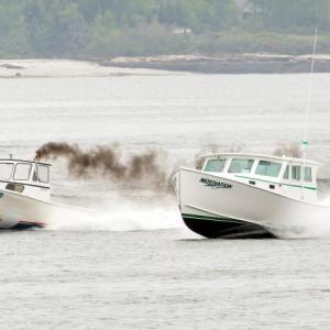 Cameron Crawford, in Wild Wild West, left, won the race for the fastest lobster boat of the day, and Tom Clemons, in Motivation, place second, in the Charlie Begin Memorial Lobster Boat Race on June 17. Courtesy of Michael Leonard