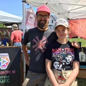 Dharma Farm owner Jeff Knox and his daughter, Kalina Chazin-Knox, take part in the Boothbay Farmers' Market on July 6. SUZI THAYER/Boothbay Register