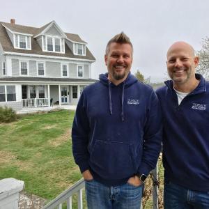 Buzz Makarewicz, left, and Mark Osborne in front of their Boothbay Harbor bed and breakfast, Topside Inn. SUZI THAYER/Boothbay Register