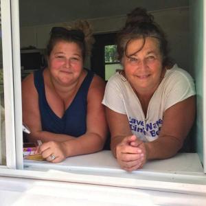 Mindy Jones, left, and her mom, Carol Heaberlin, at the take-out window of their new business, Y-Knot Gourmet Sandwiches and Desserts, on Route 1 in Newcastle. SUZI THAYER/Boothbay Register
