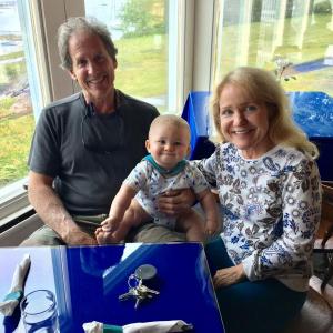 The new owners of Smuggler’s Cove Inn and the 1820 House, Alan and Marge Firpo, in the dining room with their grandson, Bryson. SUZI THAYER/Boothbay Register