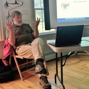 Jon Lewis, director of the Division of Aquaculture for the Department of Marine Resources, begins his presentation. JOSEPH CHARPENTIER/Boothbay Register
