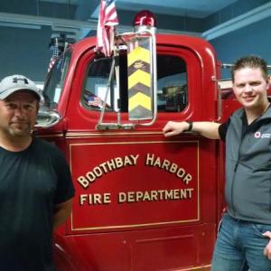 “Smoke alarms save lives. It’s that simple,” says Boothbay Harbor Fire Chief Nick Upham, left, pictured with Red Cross Disaster Program Manager Larry French. The Fire Department is among the organizations partnering with the American Red Cross of Maine to install free smoke alarms in homes on August 26.