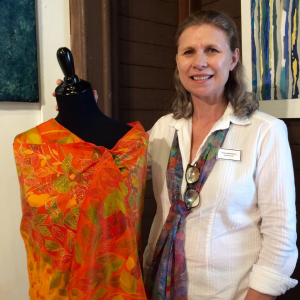 Artist Fiona Washburn with her sarong displayed at Stable Gallery. Courtesy of Polly Smith
Artist Fiona Washburn