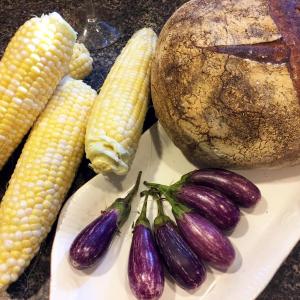 An end of summer meal, with native corn on the cob, Fairytale eggplants, and good bread. SUZI THAYER/Boothbay Register