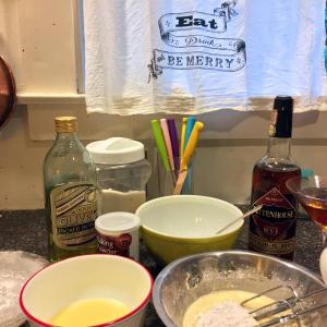 Olive oil cake in the making, made all the more fun with a manhattan (not bruised), thanks to Larry and Ellen Cray. SUZI THAYER/Boothbay Register