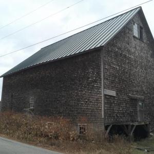 The 1910 hay barn at DRA’s Great Salt Bay Farm was damaged beyond repair by recent wind storms. Courtesy of DRA