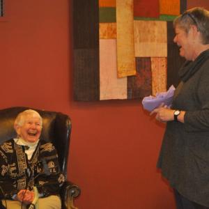 Pam Gormley, right, presenting a gift to Billy Flanagan. Courtesy photo