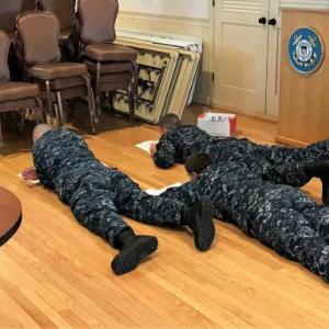 “Drop and give me 50!” Far from lying down on the job, four members of the Naval Sea Cadet Corps work their way through the 50-question final exam for the “About Boating Safely” class which was held at USCG Sector Northern New England Sat/Sun. Nov. 11/12. Five members from USCG Auxiliary Flotilla 25 in Boothbay Harbor served as instructors and proctors for the 35 cadet class. Courtesy of Ted Chatham/USCG Auxiliary