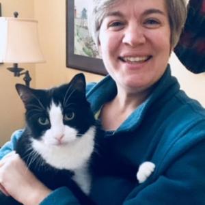 Trendy Stanchfield with her newest family member, Ermie the tuxedo cat, recently adopted from Coastal Humane Society. Ms. Stanchfileld will serve as the organization’s new executive director starting Jan. 2.