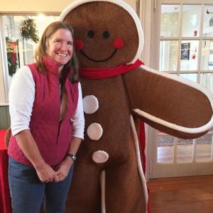 Cathy Sherrill and the gingerbread person keep watch over the crowds and the gingerbread houses on Saturday, Dec. 16. SUZI THAYER/Boothbay Register