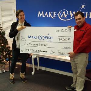 Benjamin Townsend, manager of Rocky’s Ace Hardware in Bath, Maine, presents a check to the Make-A-Wish Foundation. Courtesy photo