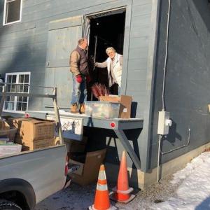 Tom Churchill and Auction co-chair Debbie Graves loading early donations into the Rotary Barn. Courtesy photo
