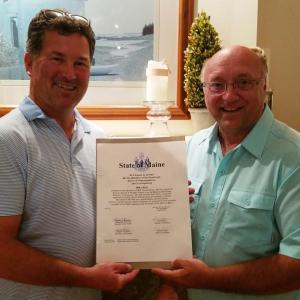 Michael Hall, left, is presented a sentiment from the state of Maine by Senator Dana Dow. Courtesy photo
