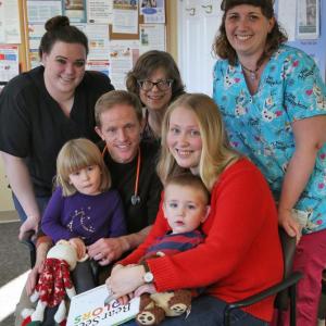 Lincoln Medical Partners physicians and medical assistants gave the 20,000th free book to two-year-old Lev Martin while he was at the Damariscotta pediatrics practice for a well child visit with his mom and sister. Back row: Kara Dow, Dr. Joann Kaplan, and Erin Smith; front: Anastasia Martin, Dr. Andy Russ, Ekaterina Martin, and Lev Martin. Courtesy of Lincoln Health