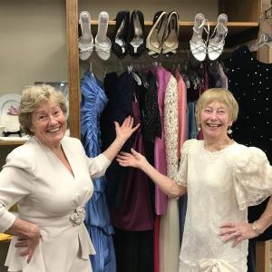 Thrift Store fashionistas, Penny Thumith, left, and Carole McCarthy having a little fun while they discuss details of the management transition for the St. Andrews Thrift Store. Courtesy photo