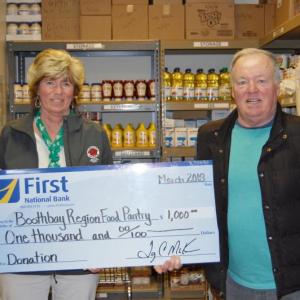Gathered for a check presentation at the Boothbay Region Food Pantry are Brenda Blackman, branch manager at First National Bank, and Tom Wilson of the Boothbay Region Food Pantry. Courtesy photo