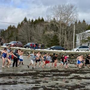 Participants line up to await the air horn blast at the Leprechaun Leap at Hendricks Head Beach on Southport Island March 15. SUZI THAYER/Boothbay Register