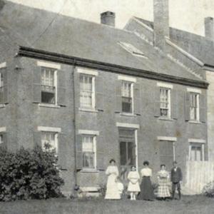 Family members outside the jailer’s residence and jail, Wiscasset, circa 1900. Courtesy of LCHA