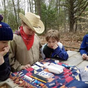 The winning Cub Scout team working on the First Aid Challenge on April 28 from left, Jeffrey McKinney, Ethan Smith, Nathan Percival and Griffin Smith. Courtesy of Robin Ford