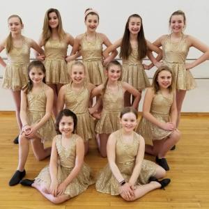 The Intermediate Jazz class, one of the several groups performing May 11 and 12, will be dancing to “Fire & Gold." Pictured from left are, back row: Madeline Orchard, Ava Schlosser, Falyn Harriman, Hannah Roberts, Katy Nein; middle row: Veda Harriman, Lily Nein, Laura Chapman, Magen Burge; front: Sarah Harris, Abigal Orchard. Courtesy of Melissa Nein