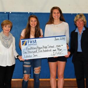 Gathered for a check presentation at Boothbay Region High School are, from left, Susan Norton, EVP/chief administration officer at First National Bank; Chloe Arsenault; Faith Blethen; and Brenda Blackman, VP/branch manager at First National Bank. Courtesy of FNB