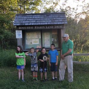 Cub Scouts from Pack 271 and horticulturist Robert Stanley of Tree Keepers at Penny Lake Preserve. Courtesy of Robin Ford