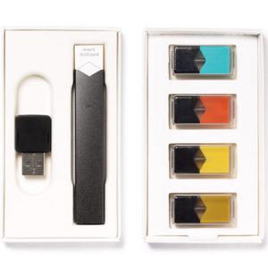 JUUL kit including the inhaler, battery pack, and four pods. Courtesy of JUUL.