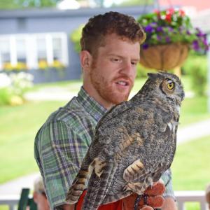A Chewonki staff member holding a live owl. Courtesy photo