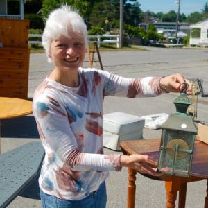 Lori Bouley, pictured, said yard sale items sold well on Saturday at the annual Our Lady, Queen of Peace Summer Fair. ART MAYERS/Boothbay Register