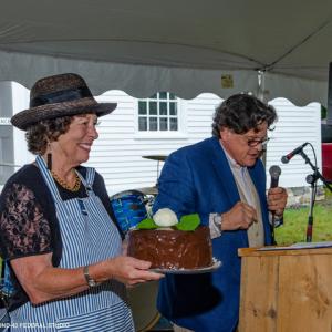 Wendy Ross Eichler displays a “Two in One Dessert,” that sold for a record-breaking $1,000 through the deft efforts of auctioneer Kaja Veilleux of Thomaston Place Auction Galleries. Bob Bond photo