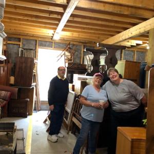 2017 Auction co-chair Henry Wyatt with 2018 Auction co-chairs Debbie Graves and Laurie Zimmerli surveying the goods at the Rotary Barn. Courtesy of Sandra Leonard