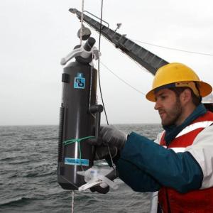 Ben Twining prepares to collect a water sample during a research cruise aboard the R/V Melville.Twining will discuss his research into metal limitation in the ocean during a Café Sci event at Bigelow Laboratory on July 31 at 5 p.m. Rebecca Fowler photo