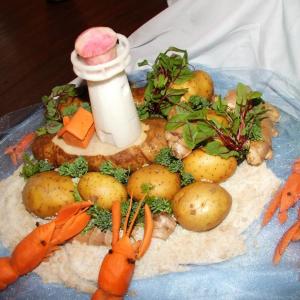 Aerial shot of Somjit Lim’s lighthouse scene. This is one of many food sculptures that led judges to name “Welcome to Boothbay Harbor” the Most Spectacular in the region’s first edible sculpture contest! Somjit Lim