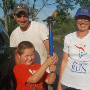 Brady Griffin tries carrying the torch at Moody’s Diner Aug. 9. ART MAYERS/Wiscasset Newspaper