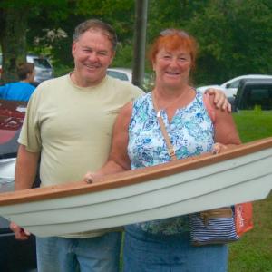 Berchel and Lisa Rollins buy their dream boat at the Southport Fire Department auction. ART MAYERS/Boothbay Register