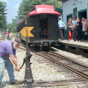 A WW&F volunteer switches rails as riders board the train at last year’s event. ART MAYERS/Wiscasset Newspaper