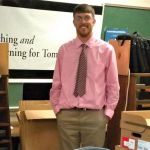 Zachary Gray, BRES technology integrator in the BRES computer lab, surrounded by devices for students and teachers. JANE CARPENTER/Boothbay Register