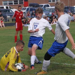 Caleb Gabriele hits the turf for a save in the first half of Friday afternoon’s game with Oak Hill. Also shown is Raider Caleb Leighton #17. PHIL DI VECE/Wiscasset Newspaper