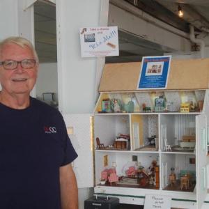 Shawn Lewin with the doll house. ART MAYERS/Boothbay Register