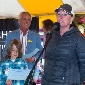 Awarding a grant from the Edward A. Myers Marine Conservation Fund at a past Pemaquid Oyster Festival is Tom Myers, center, son of Edward Myers. Accepting the grant for Great Salt Bay Community School are student Eli Melanson, left, and teacher Jennifer Gregg, right. Courtesy of scottbsmith.com