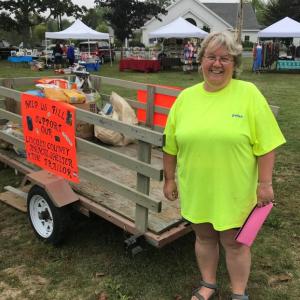 Donna Gregory stands next to the cart set up for donations to the Lincoln County Animal Shelter. KELLIE BIGOS/Boothbay Register