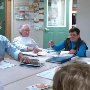 Watershed Center for the Ceramic Arts Executive Director Francine Rudolph, left, and Watershed board member Jeff Musich review the site plan for a change of use application with members of the Edgecomb planning board. JANE CARPENTER/ Boothbay Register