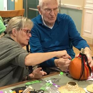 BRGC member Abbie Shaw assists resident with pumpkin decorating. Courtesy photo
