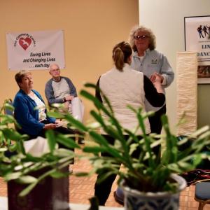 Personal trainer Mary Baudo helps Fit, Flexible & Strong members improve their balance. Bob Crink photo