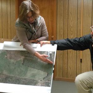 Watershed Center for the Ceramic Arts executive director Francine Rudolph assisted by Jeff Musich explains the proposal Oct. 4. JANE CARPENTER/Boothbay Register