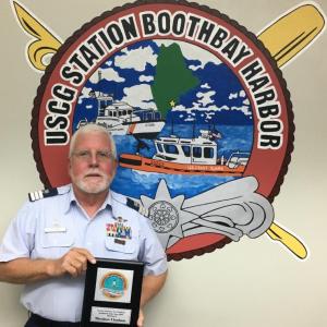 East Boothbay resident Ted Chatham is shown with “USCG Auxiliary Division 2 Auxiliarist of the Year” plaque, which he received Thursday, Oct. 11 at the October Flotilla 25 meeting at CG Station Boothbay Harbor. CG Auxiliary Division 2 includes flotillas in Portsmouth, Saco, Portland and Boothbay Harbor, and represents a total membership of over 200. Photo by Bruce MacCormac, Coast Guard Auxiliary