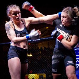 Chelsea Tucker, left, won her first MMA bout last month with a technical knockout of BJ Garceau in a flyweight division match in Portland. Courtesy photo