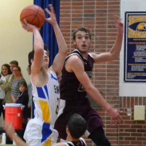 Seahawk guard Brett Hollowell drives against two Richmond defenders Dec. 20 in Boothbay’s fifth win of the season. BILL PEARSON/Boothbay Register